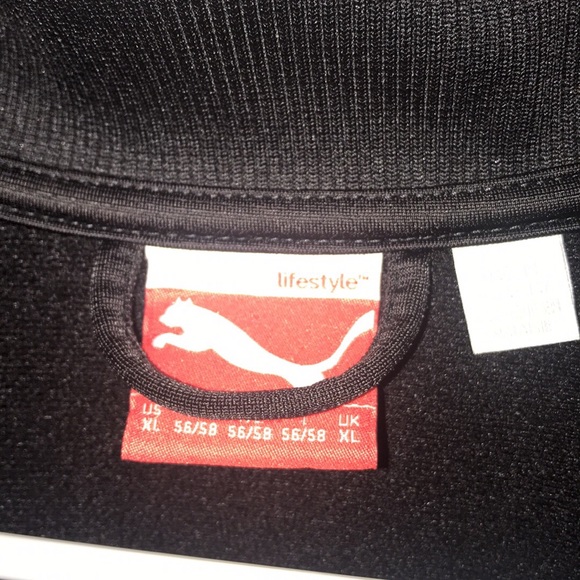 orange and black puma jacket